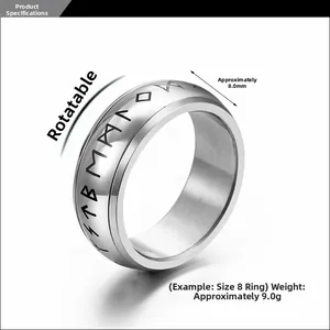 Detail view of rotatable titanium steel stress relief ring with engraved black runes