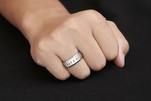 Detail view of silver titanium steel ring with Nordic Runic engravings for men