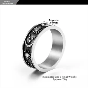 Close-up of vintage celestial ring band showing 7.9mm width and sun moon embossed details