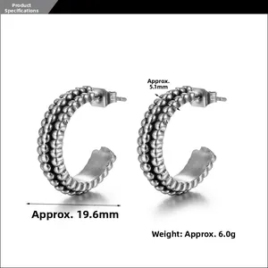 Macro detail of retro silver C-shape earrings with beaded texture and size measurements