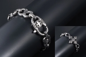 Detail of gothic stainless steel bracelet with cross patterns and lobster clasp