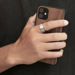 Polished silver titanium steel ring for men featuring a geometric stepped texture design