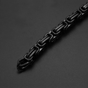 Detail of black Byzantine link chain in stainless steel with a gothic street style