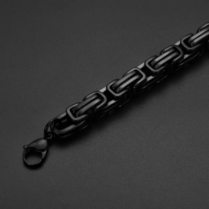 Close-up of black stainless steel Byzantine chain with large lobster clasp fastener