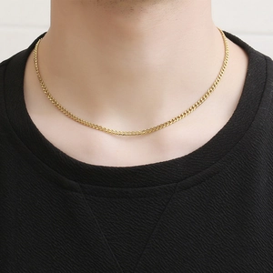 Polished gold 4mm flat curb chain necklace for men shown on a model neck with black T-shirt