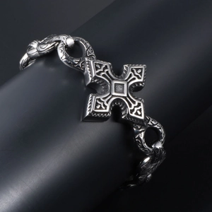 Gothic punk stainless steel bracelet featuring a large engraved cross on black holder