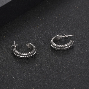 Retro titanium steel C-shaped stud earrings with embossed double-row dot pattern