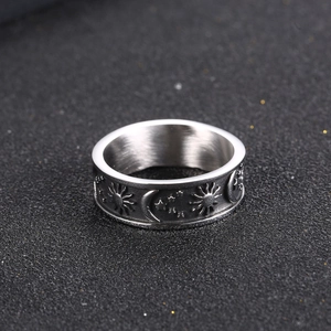 Celestial stainless steel ring featuring detailed sun, moon and star relief carvings