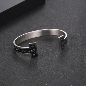 Viking rune silver cuff bracelet with black enamel accents and Nordic knot symbols