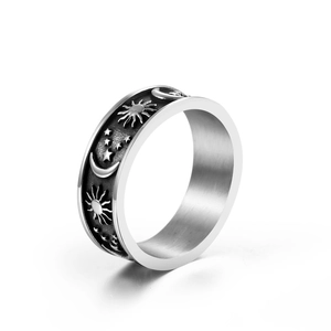 Vintage stainless steel ring featuring celestial sun moon and star embossed patterns