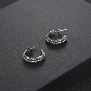 Retro C-shaped titanium steel hoop earrings with double row dot pattern texture