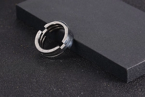 Macro detail of titanium steel ring with Forever engraving and dual-layer structure