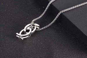 Detail of silver titanium steel ring necklace with Love Forever engraving on pendant