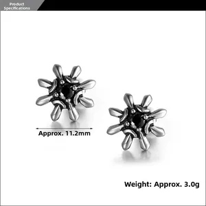 Detail of starburst stud earrings with black zircon center and 11.2mm size measurement