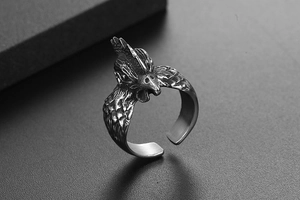 Detailed view of vintage rooster ring featuring intricate carving and antique silver finish