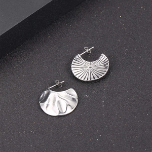 Silver vintage fan-shaped C-style stud earrings with textured stainless steel surface