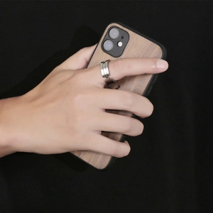Men's silver mechanical chain style titanium steel ring worn on index finger with phone
