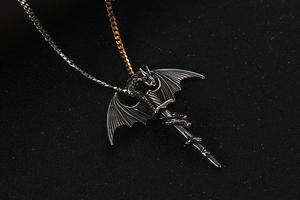 Macro shot of retro dragon sword pendant with bicolored metallic chain detailing