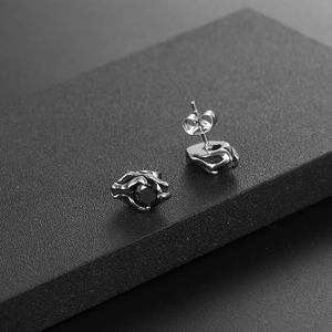 Gothic titanium steel stud earrings with black zircon claw setting in a punk rock style