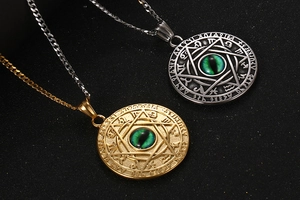 Detail of vintage titanium steel zodiac pendants with green devil eye and mystic runes
