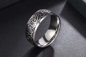 Detailed close-up of Viking Celtic knot pattern on silver and black stainless steel ring