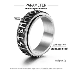 Macro shot of stainless steel spinner ring with Nordic runes and vintage black finish