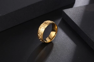 Detail of gold-plated stainless steel ring with Celtic Triquetra knot engraving