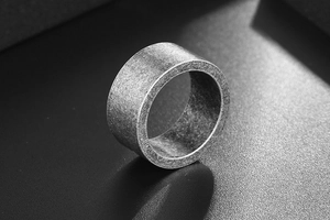 Macro shot showing retro bronze finish texture and industrial matte surface of the ring