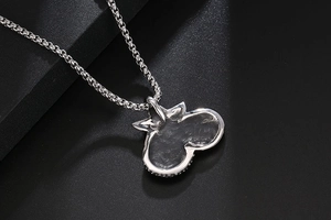 Detailed back view of a starfish pendant showing matte metal texture and box chain link