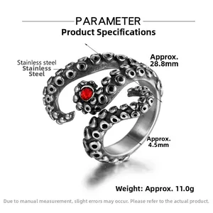 Macro shot of octopus tentacle ring in vintage steel with a central red zircon stone