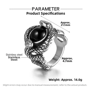 Detail of vintage double snake ring with black onyx inlay and stainless steel texture