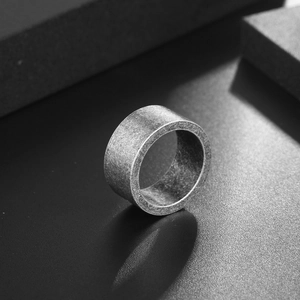 Minimalist men's titanium steel ring with vintage silver-grey finish and industrial texture
