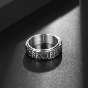 Vintage stainless steel spinner ring featuring Nordic rune engravings and brushed finish