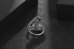 Macro detail of silver octopus tentacle ring showing textured suckers and retro punk design