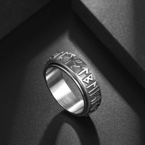 Vintage stainless steel spinner ring with engraved Nordic runes and brushed metal finish