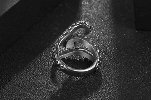 Macro detail of octopus tentacle ring in vintage stainless steel with suction cup texture