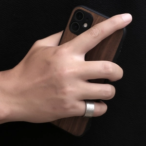 Men's retro textured titanium steel ring in silver finish with industrial style