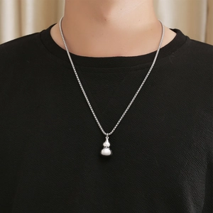 Vintage silver titanium steel Wu Lou pendant necklace with polished finish on model