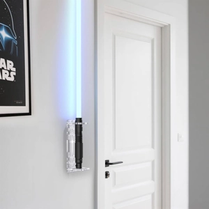Detail of transparent acrylic lightsaber wall mount with star laser engraved patterns