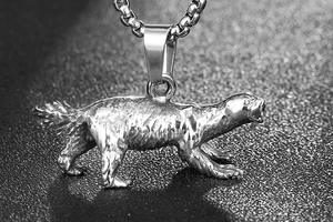 Macro shot of vintage honey badger pendant with detailed fur texture on stainless steel
