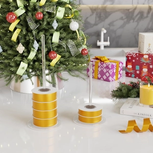 Set of 4 clear acrylic ribbon storage racks with satin yellow ribbon rolls for holiday decor