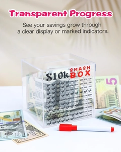 Macro view of clear acrylic money box with $10k savings goal grid and red marker pen