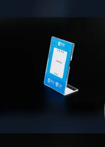 Side view of L-shaped clear acrylic desktop sign holder for QR code payment displays
