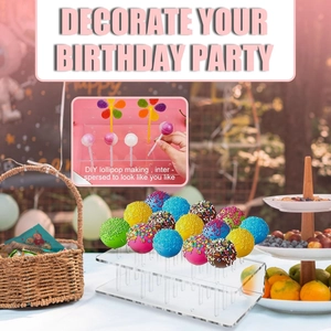 Acrylic lollipop stand in an outdoor birthday party setting with colorful cake pops