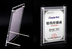 Dual-use A4 acrylic frame detail showing desktop stand legs and wall hanging hook