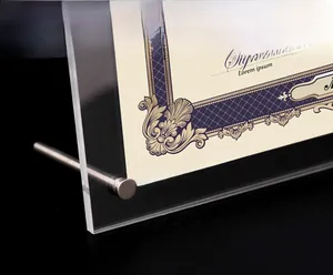 Close-up of thick transparent acrylic certificate frame with metal support stand