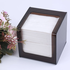 Detail of dark brown translucent acrylic tissue box showing side opening and internal paper
