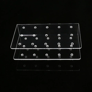 Macro view of clear 21-hole dual-layer acrylic lollipop display stand on black background