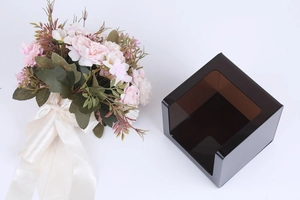 Close-up of black acrylic tissue box featuring a brown translucent side window