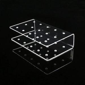 Macro detail of U-shaped clear acrylic lollipop display stand with dual layers and precise holes